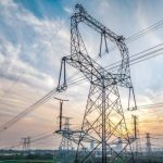 High voltage electricity tower and natural scenery at sunset